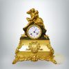 Francia felesütős kandalló óra, figurális aranyozott bronz tok
